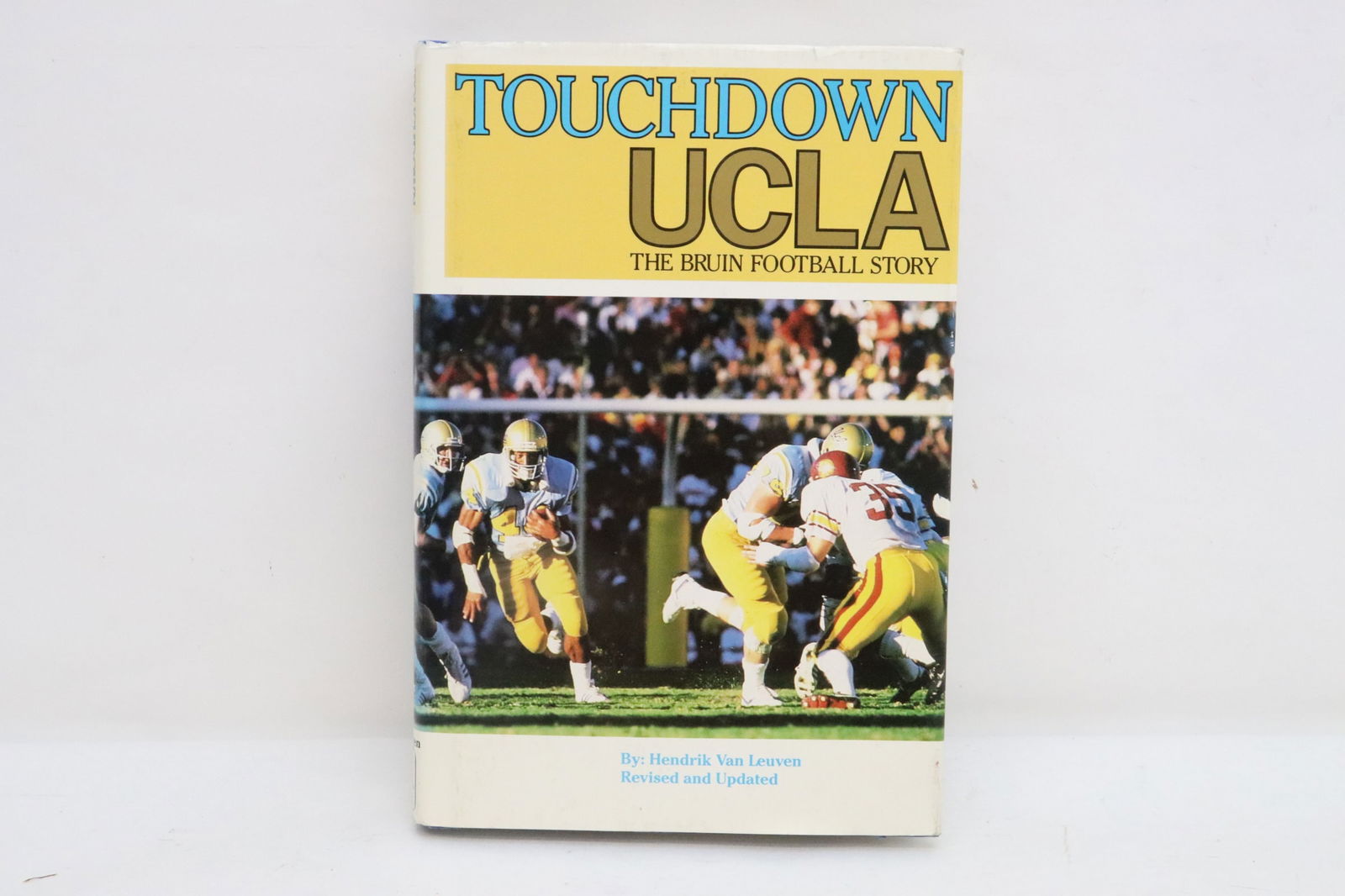 "Touch Down, The UCLA Bruin Football" signed by former players (1 of 7)