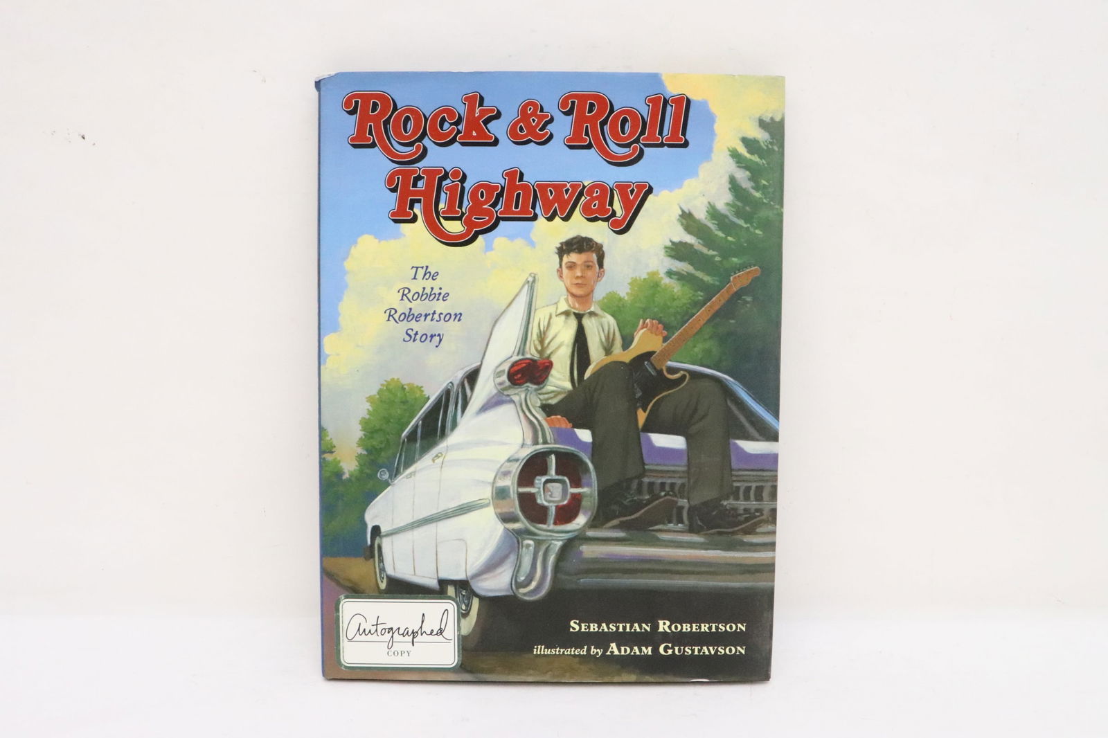 signed book by Sebastian Robertson: "rock and roll highway, the Robbie Roberson story" by Sebastian Robertson, signed by Robbie Robertson and ?