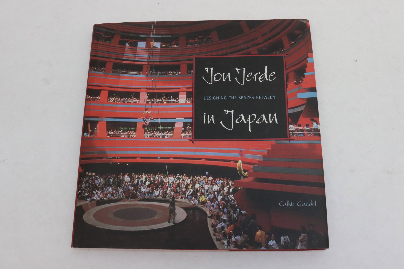 "Jon Jerde designing the spaces between in Japan" signed: "Jon Jerde designing the spaces between in Japan" signed by Cathie Gandel (1st printing, 2000)