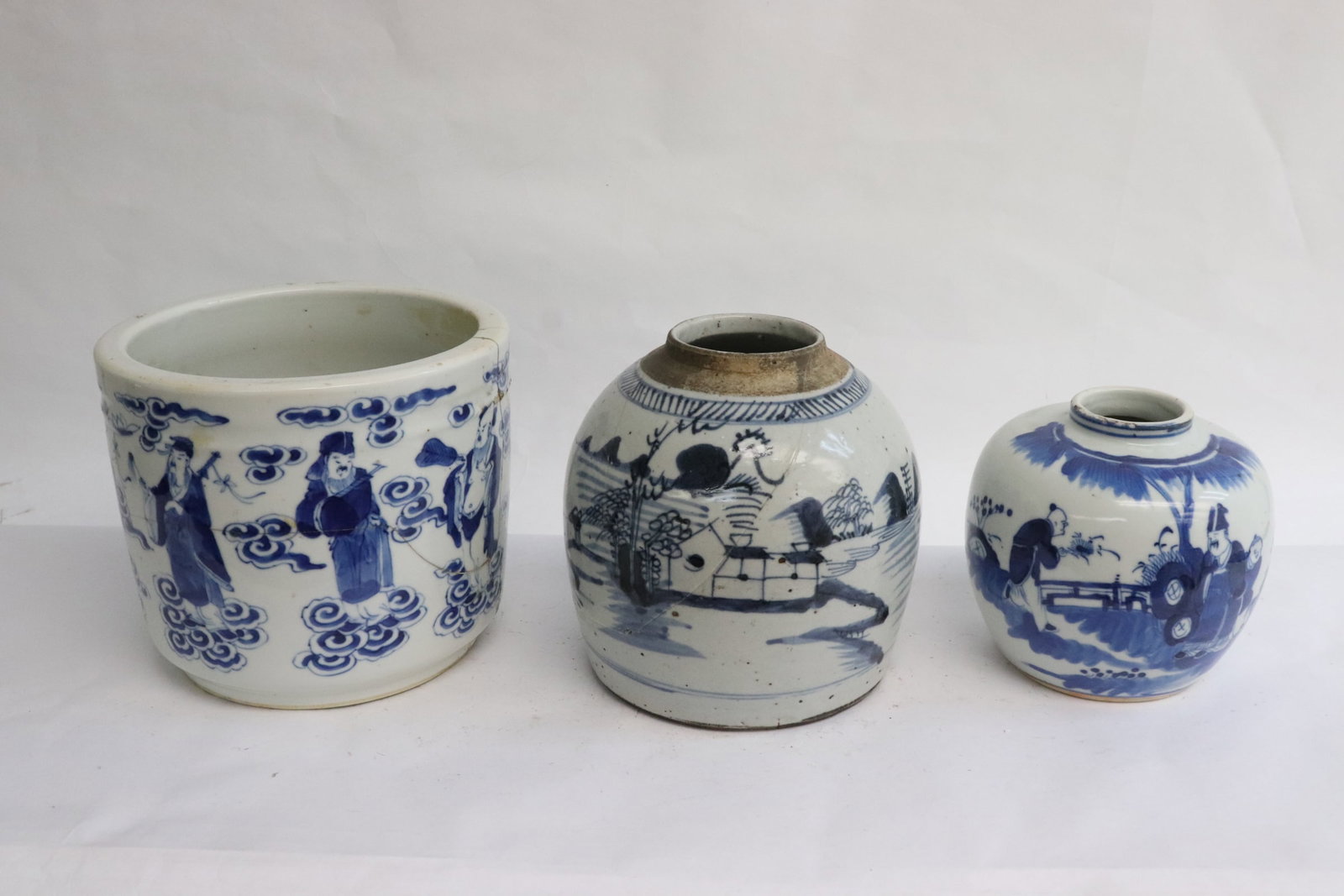 3 pieces antique blue and white porcelain: 3 pieces antique blue and white porcelain; a brush holder (damage) (6"x7"dia), a blue and white jar (damage) (6.25"x6.25"dia), and a small blue and white jar (4.8"x5.3"dia)