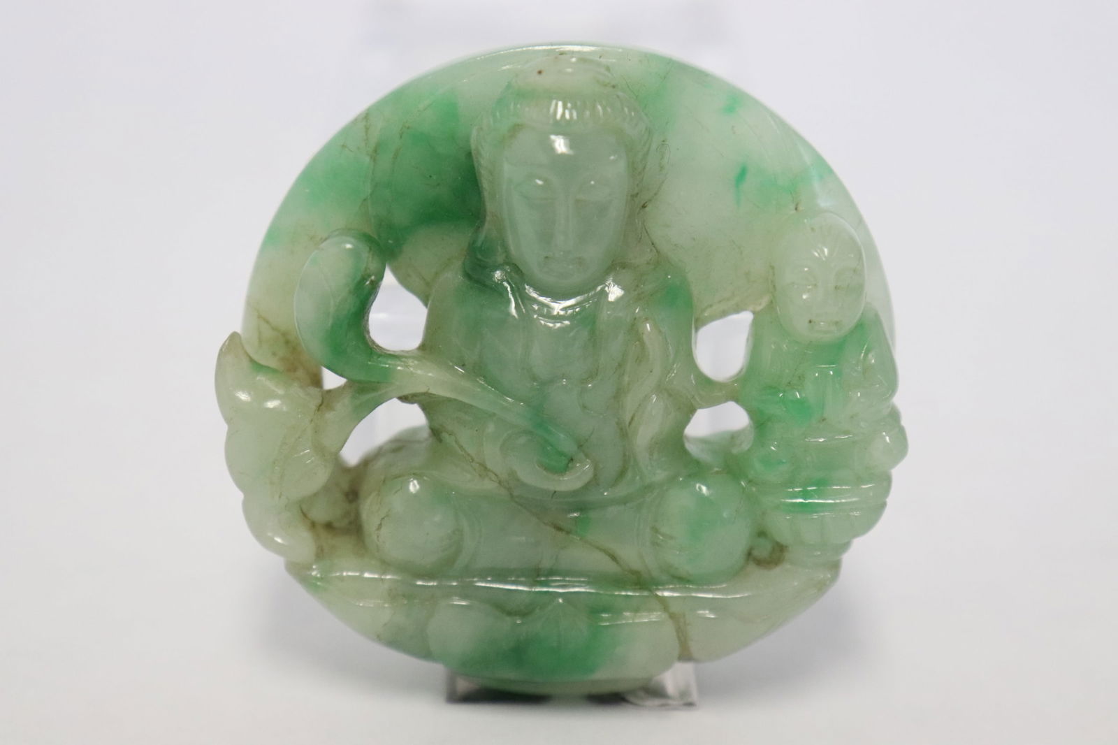 A jadeite carved ornament in deity motif (1 of 7)