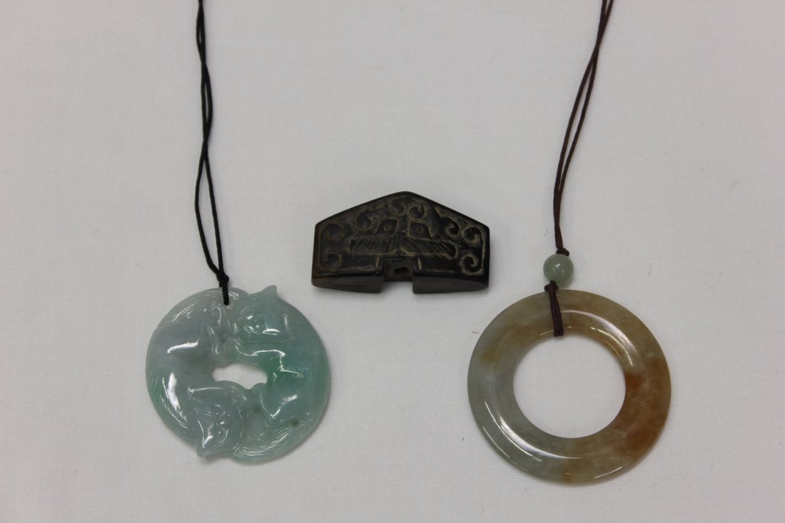 Jadeite carved plaque & disc, & jade sword guard: Jadeite carved circular plaque depicting 2 cats (2.7" diameter), jadeite carved circular disc (2.1"o.d.x1.25"i.d.), and a jade carved sword guard (1.7"Wx0.8"Hx0.5"D)