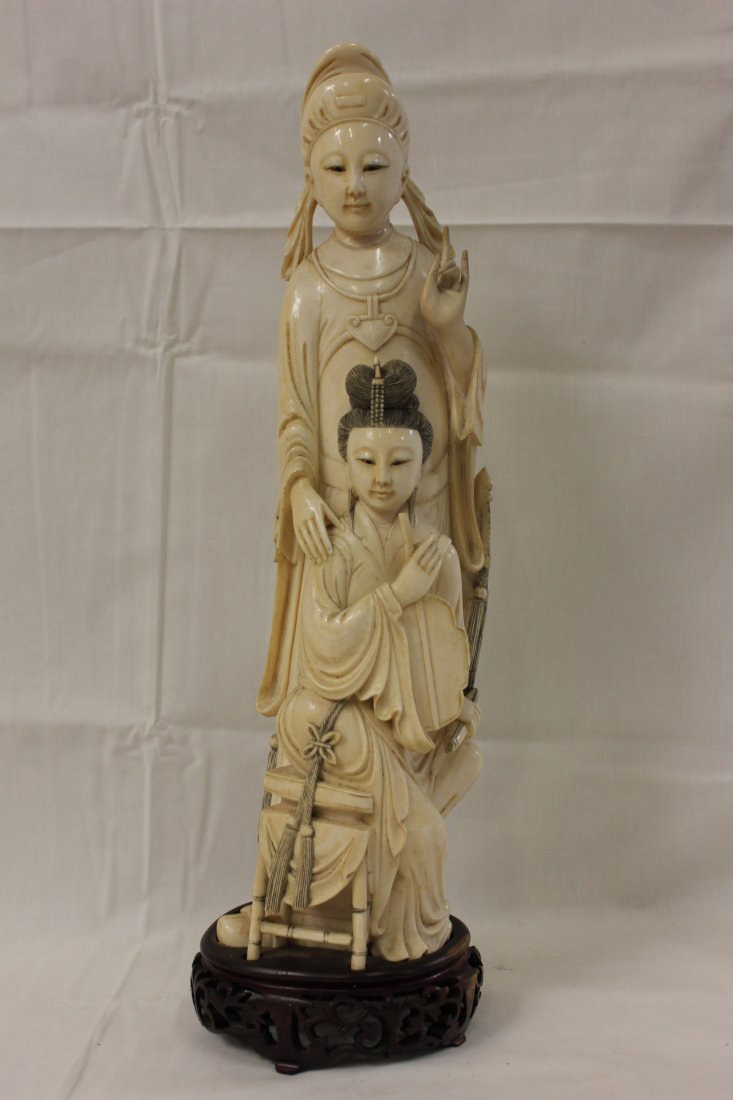 Chinese ivory carved scholar with his wife: A fine Chinese ivory carving depicting scholar with his wife seating in front of him (16"H)