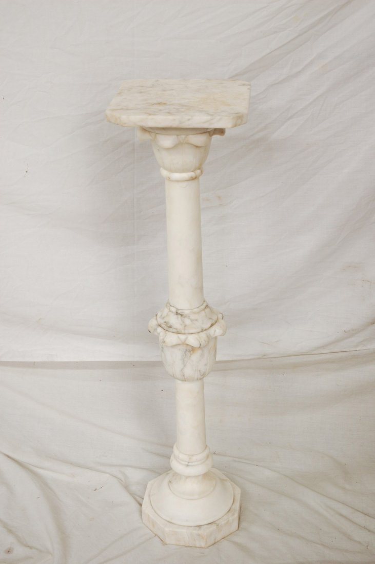 A carved alabaster pedestal: A carved alabaster pedestal (9.1"x9.1"x36.6")