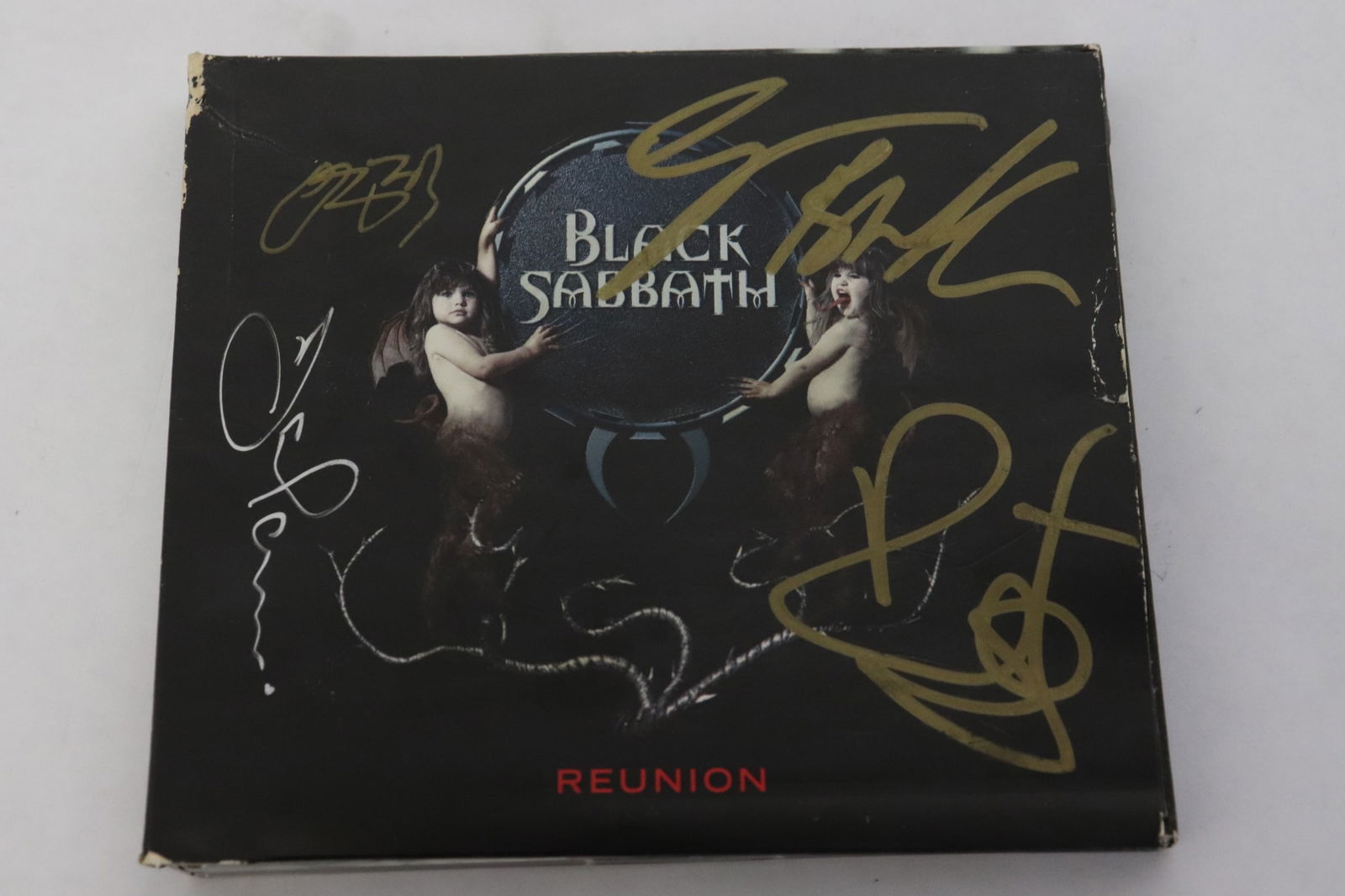 CD signed by Ozzy Osbourne, Bill Ward, Tony Limmi, and Geezer Butler (1 of 3)