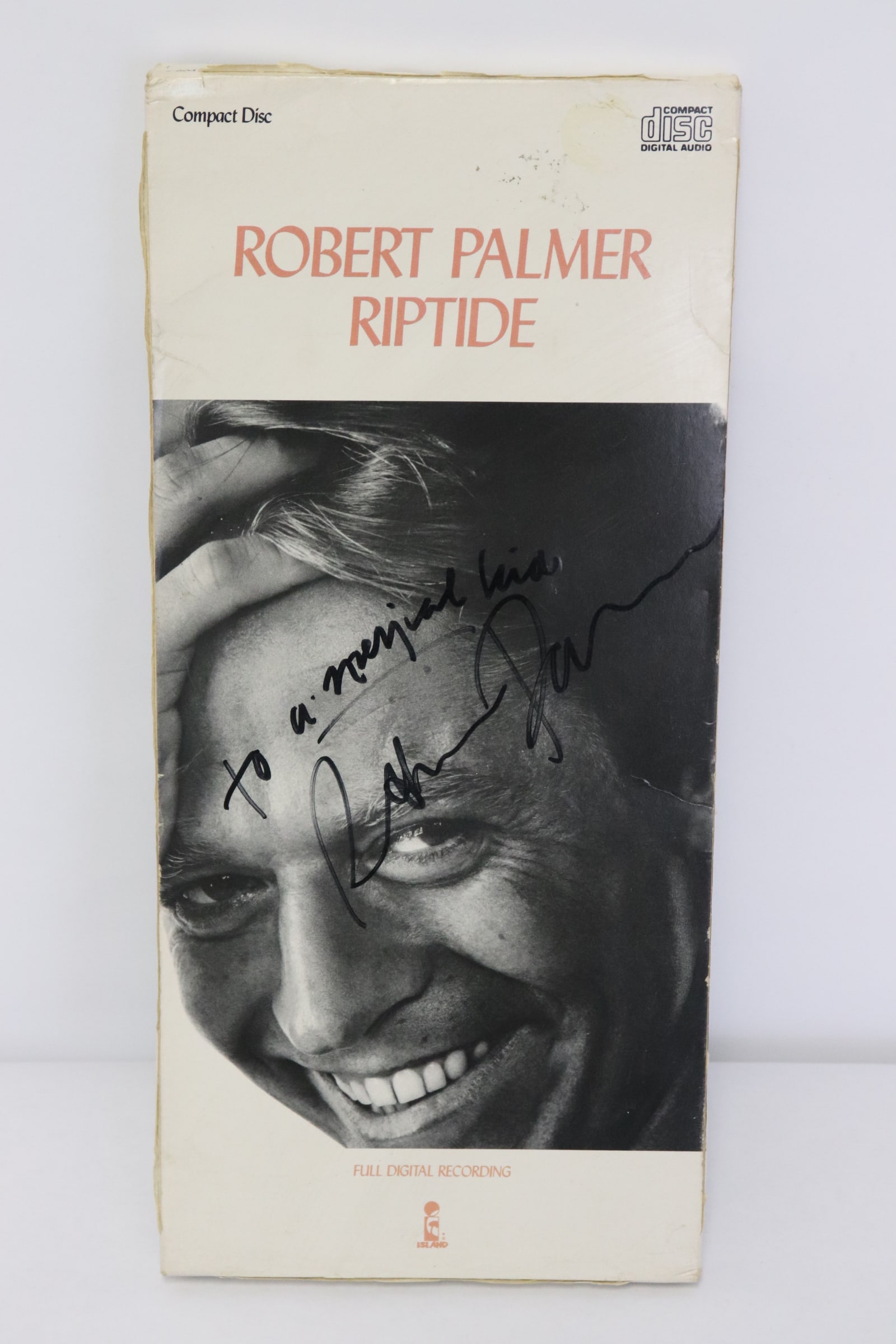 Original 1985 CD "riptide" signed by Robert Palmer: Original 1985 CD "riptide" signed by Robert Palmer
