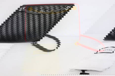 A Gucci GG Marmont accordion shoulder bag: A Gucci GG Marmont accordion shoulder bag (1.9"x11"x8") with diagonal quilt leather in as new condition with dust bag