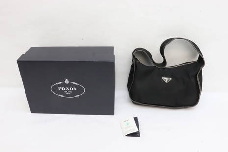 A Prada nylon handbag with box: A Prada nylon handbag (3.5"x12"x8") with leather trim in very fine condition with box