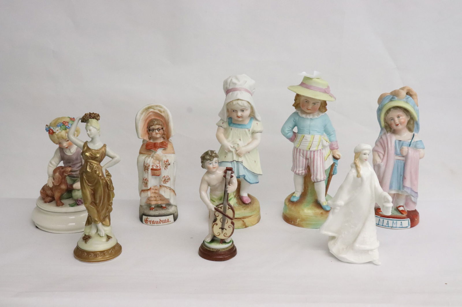 9 porcelain/ bisque figures (1 of 10)
