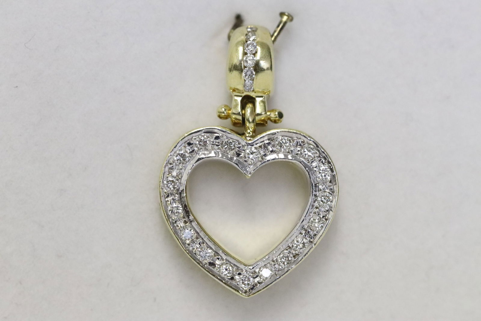 An 18K Y/G heart shape diamond pendant (1 of 10)