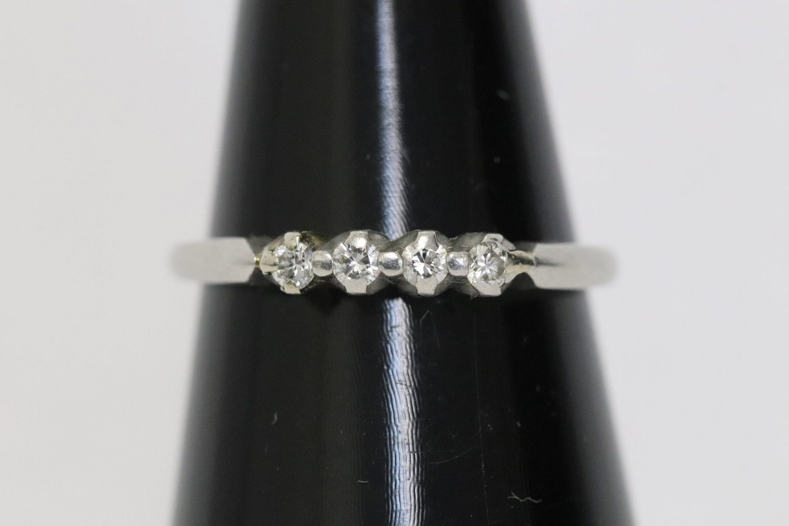 A platinum diamond band: A platinum diamond band, wt. 2.7gm, size 6.5