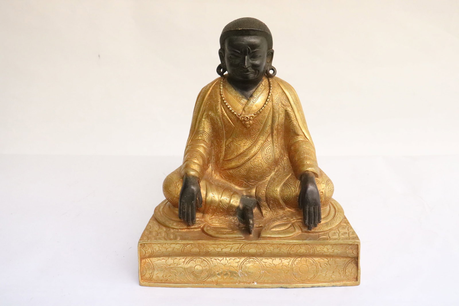 Chinese parcel gilt bronze sculpture of deity: Chinese parcel gilt bronze sculpture of deity, 7.35"H