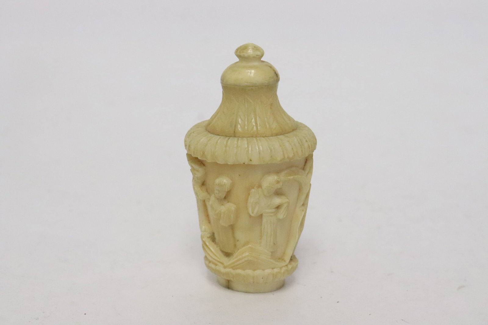 Vintage Chinese bone carved snuff bottle: Vintage Chinese bone carved snuff bottle with decoration in relief, 2.35"x1.2"x0.95"