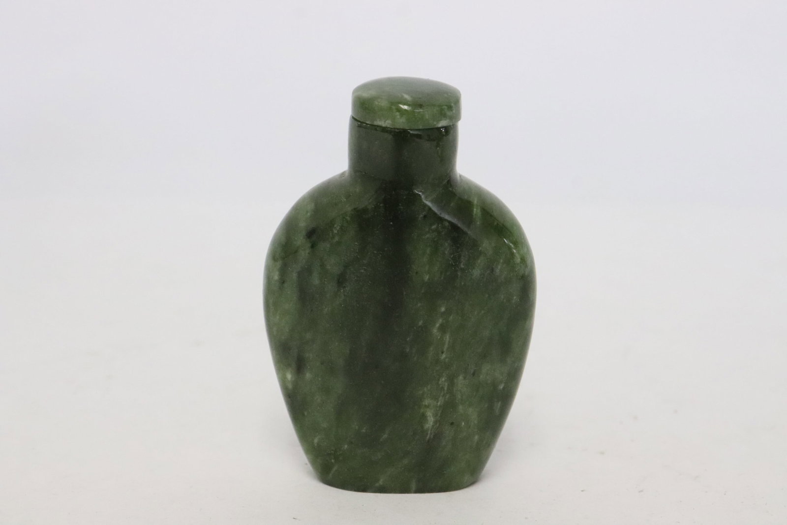 Green jade snuff bottle: Green jade snuff bottle, 2.3"x1.6"x0.6"