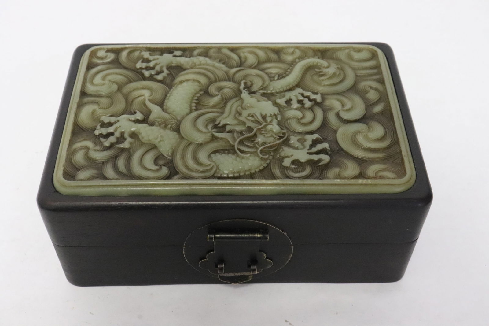 A wood box with jade like stone plaque on top (1 of 7)