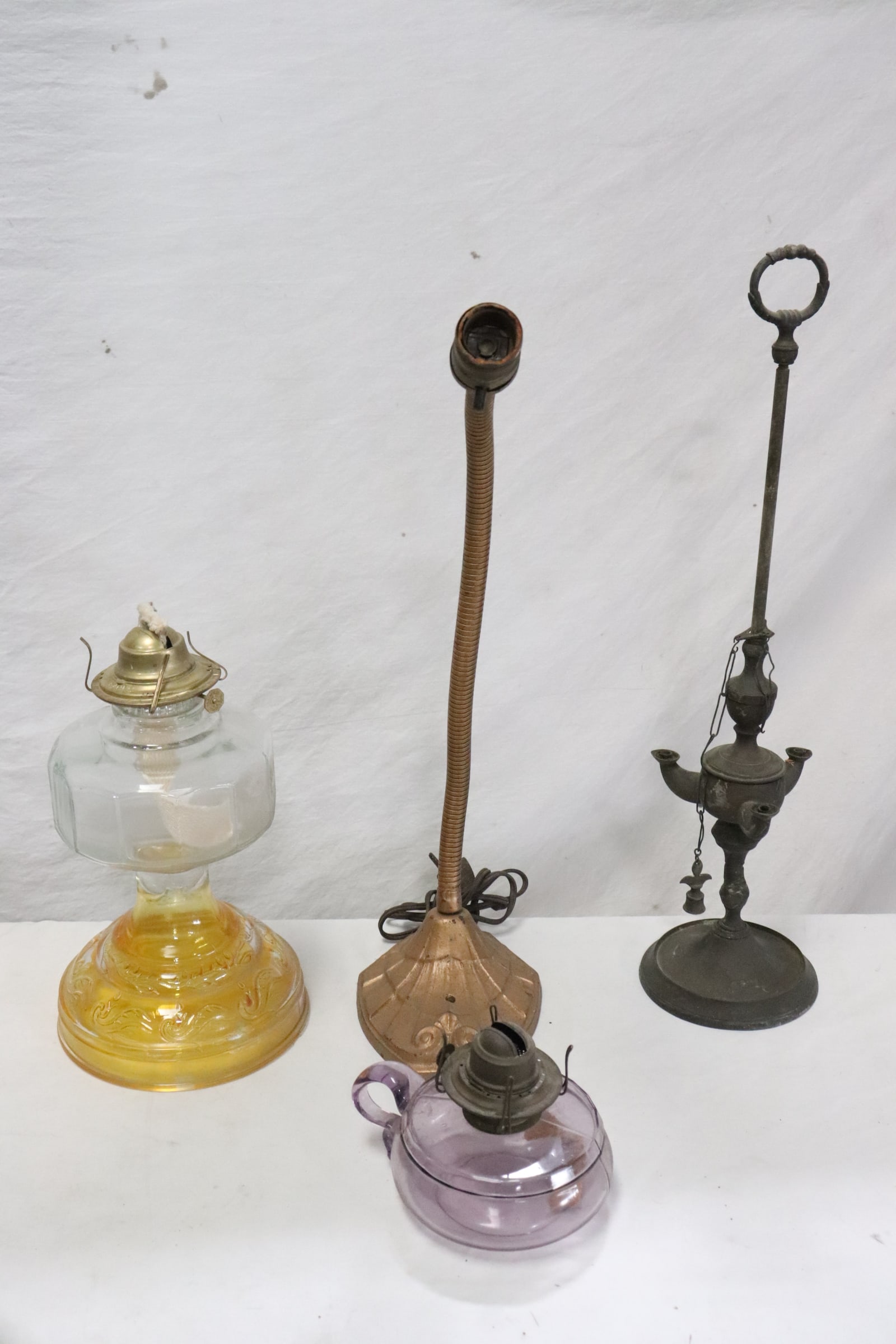 Art deco lamp, and 3 oil lamps: Art deco lamp (20.2"H), and 3 oil lamps (4.6"H - 19.7"H)