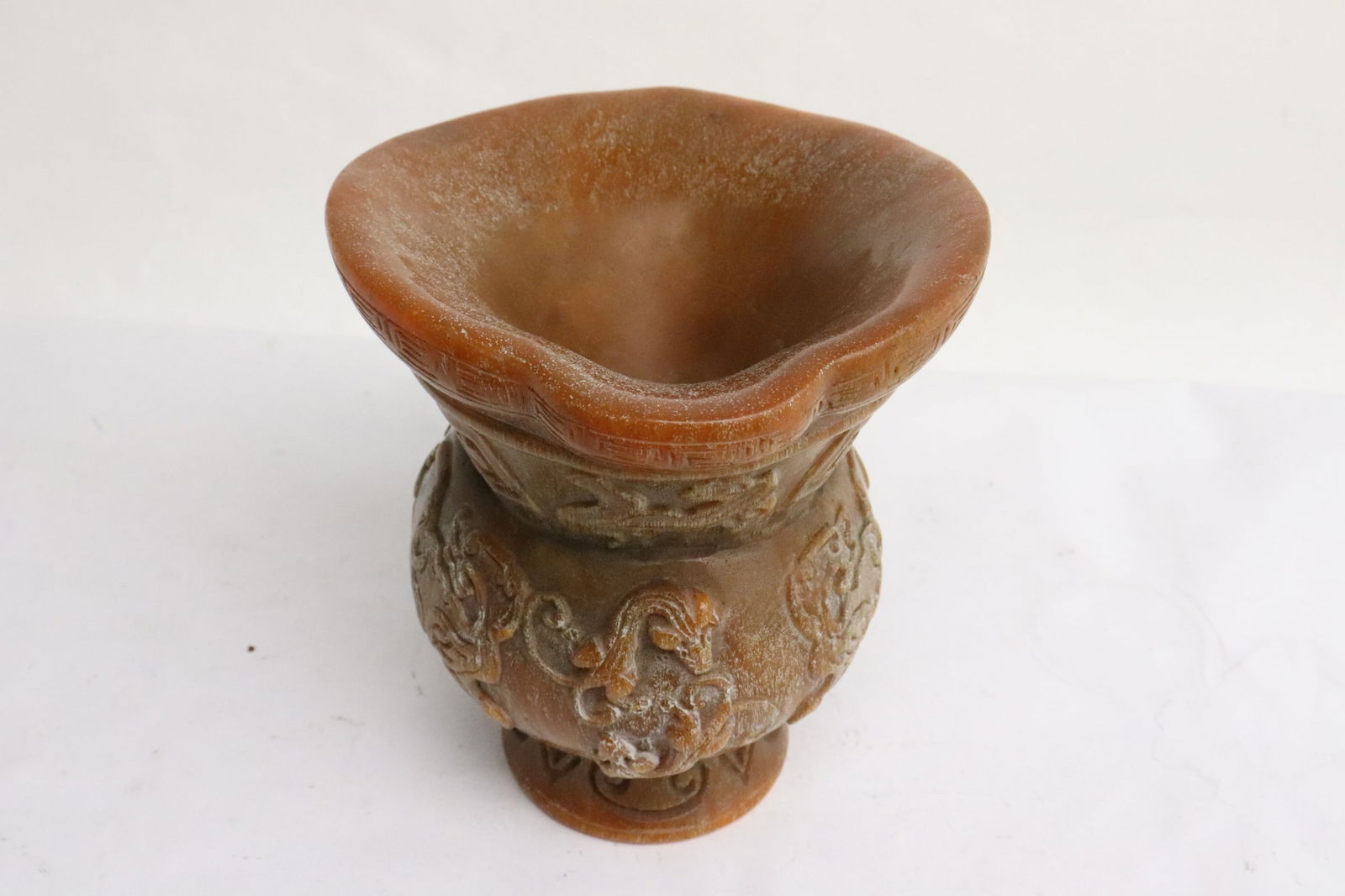 A simulated horn carved libation cup (1 of 8)