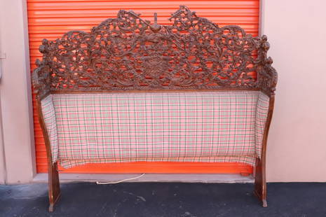 A 17th/18th century elaborately carved headboard: A 17th/18th century European (probably Belgium) elaborately carved headboard depicting angle motif decoration on top, according to the consigner family, it once belong to Neil Simon, losses, 73"x77.7"