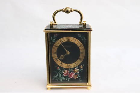 A Swiss made traveling clock: A beautiful Swiss made traveling clock with enameled onyx and bronze case, 6.15"x3.4"x2.2"