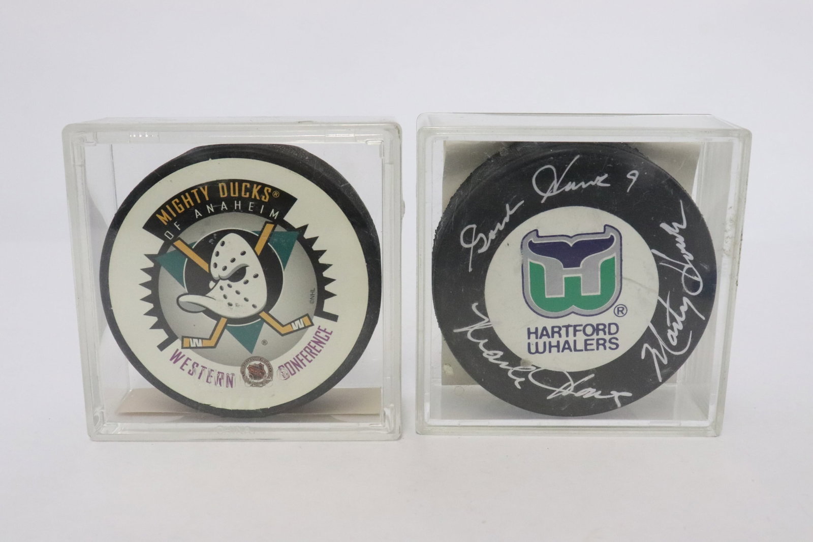 2 group signed hockey pucks: 2 group signed hockey pucks