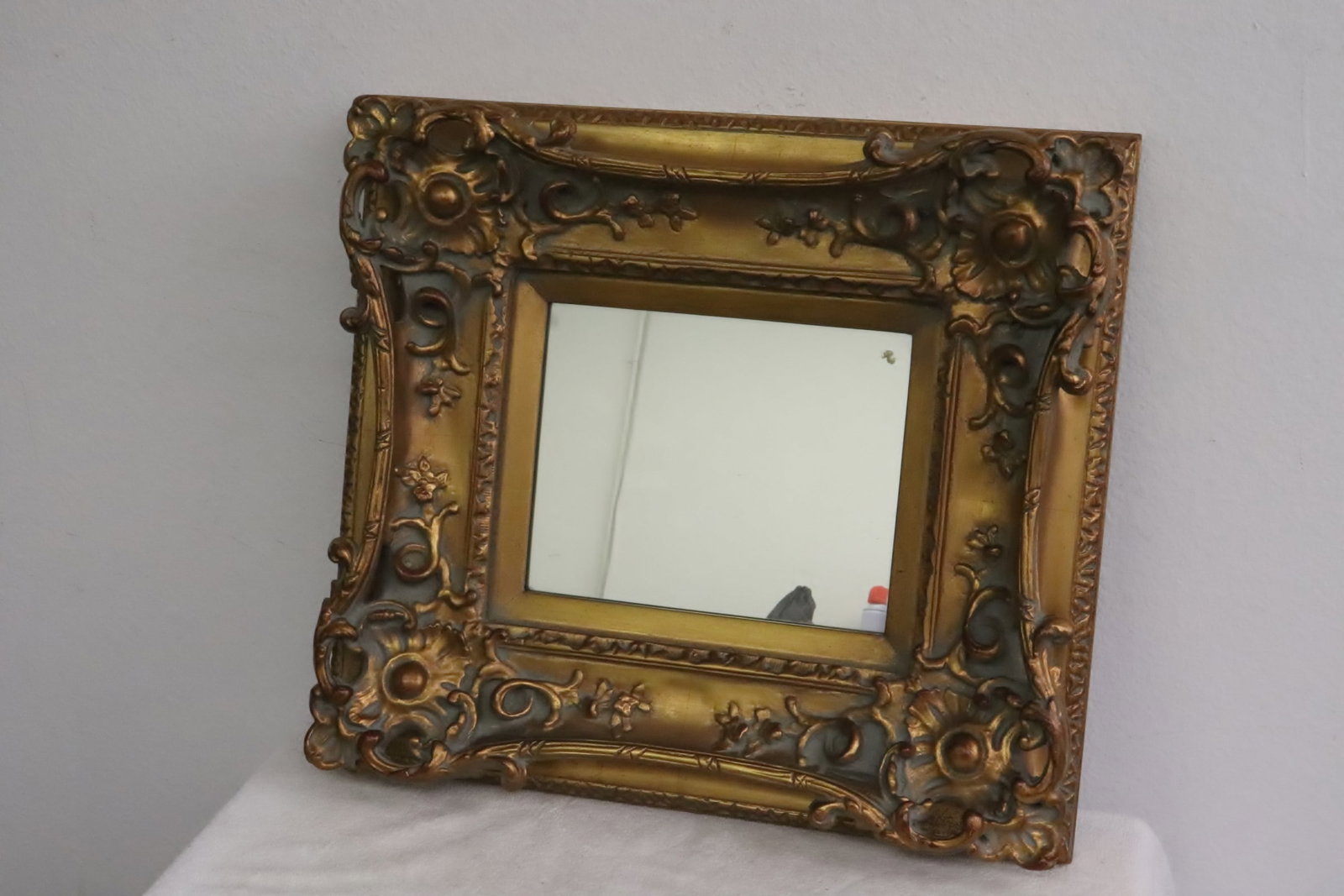 A fancy gilt framed wall mirror (1 of 6)