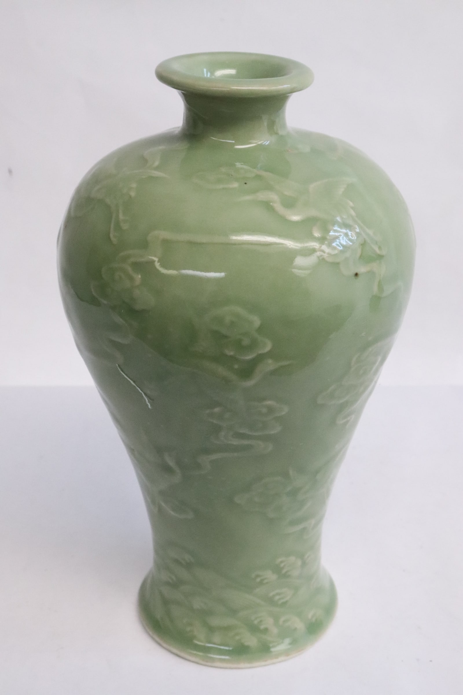a celadon meiping: a celadon meiping embossed with crane scene decoration, 8.2"x4.7"dia