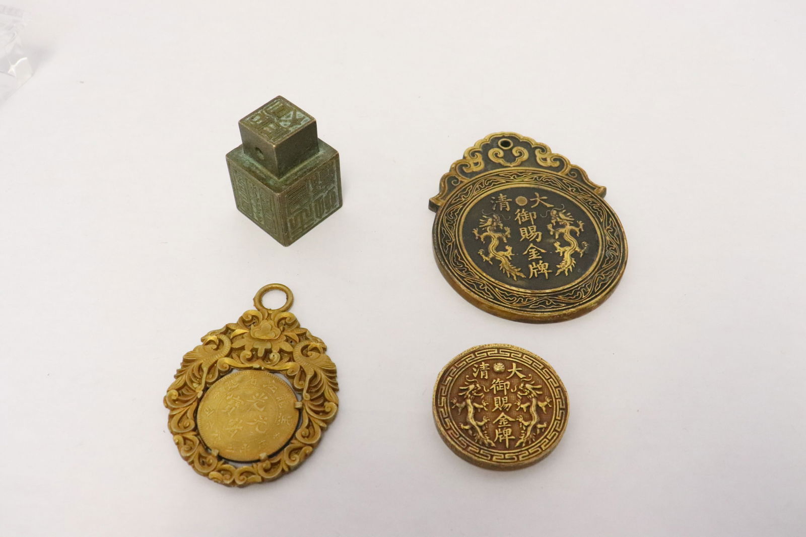 a bronze seal, and 3 misc. brass ornaments (1 of 10)