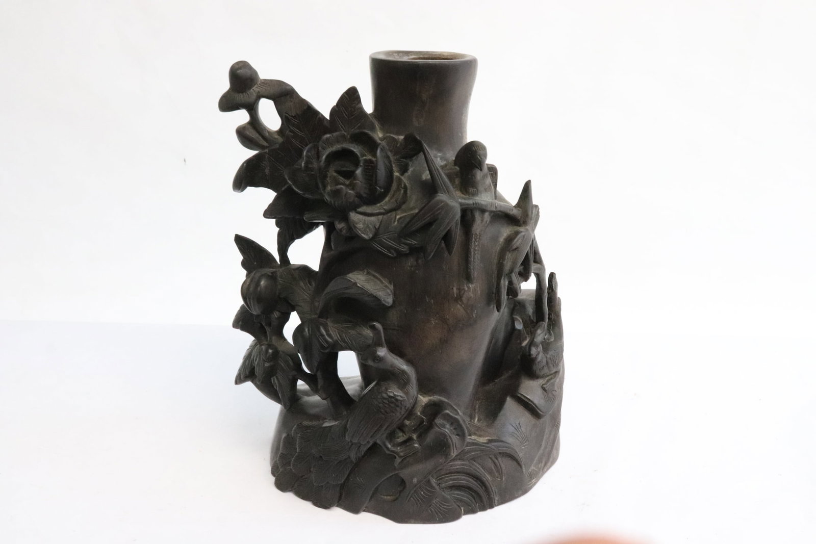 A wood carved vase: A wood carved vase decorated with birds and flowers in high relief, 8.6"x6.8"x3.95"