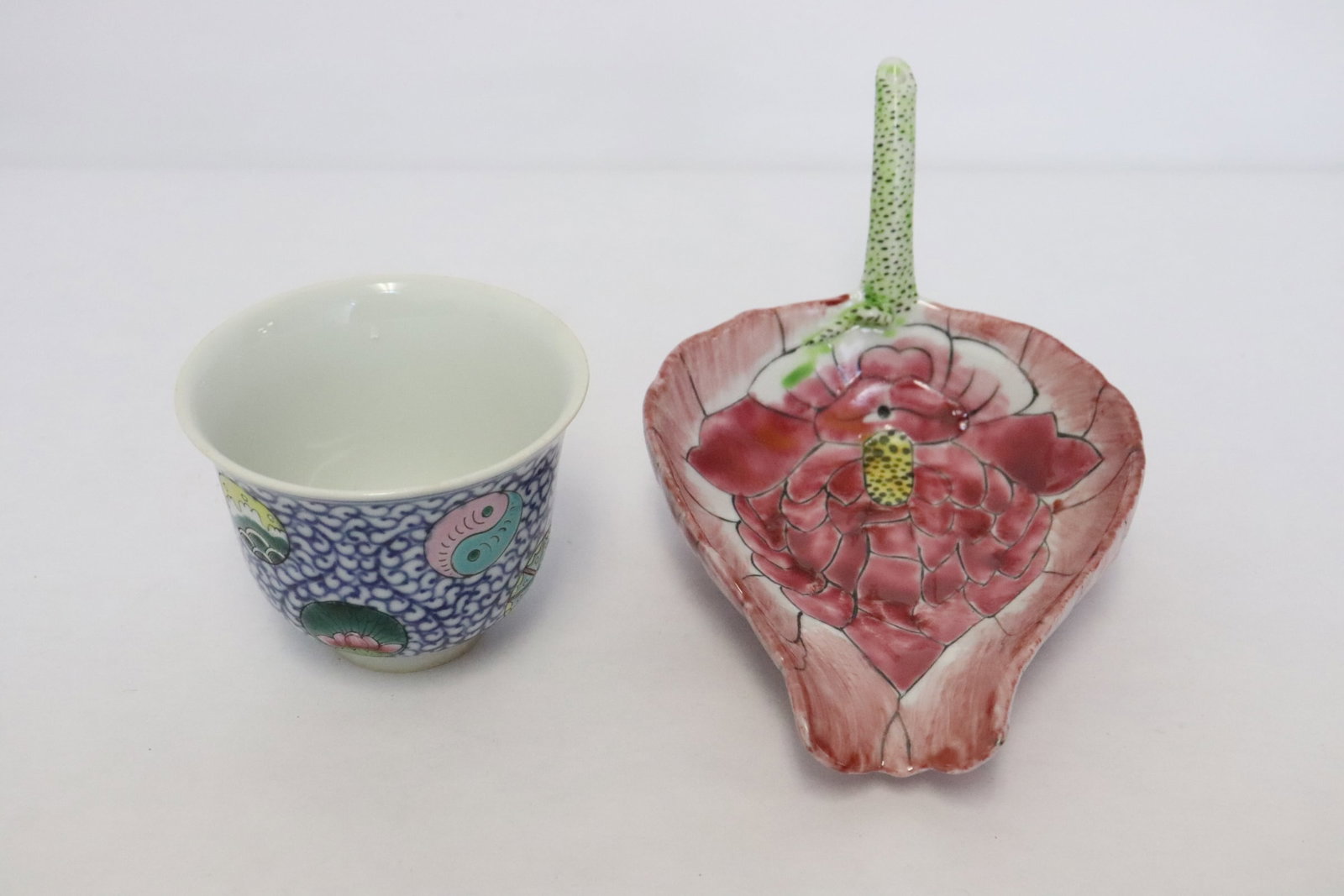 2 porcelain pieces: 2 pieces; a famille rose porcelain tea cup (2.5"x3.2"dia) and a wucai porcelain wine server (3.35"x6.5"x4.25")