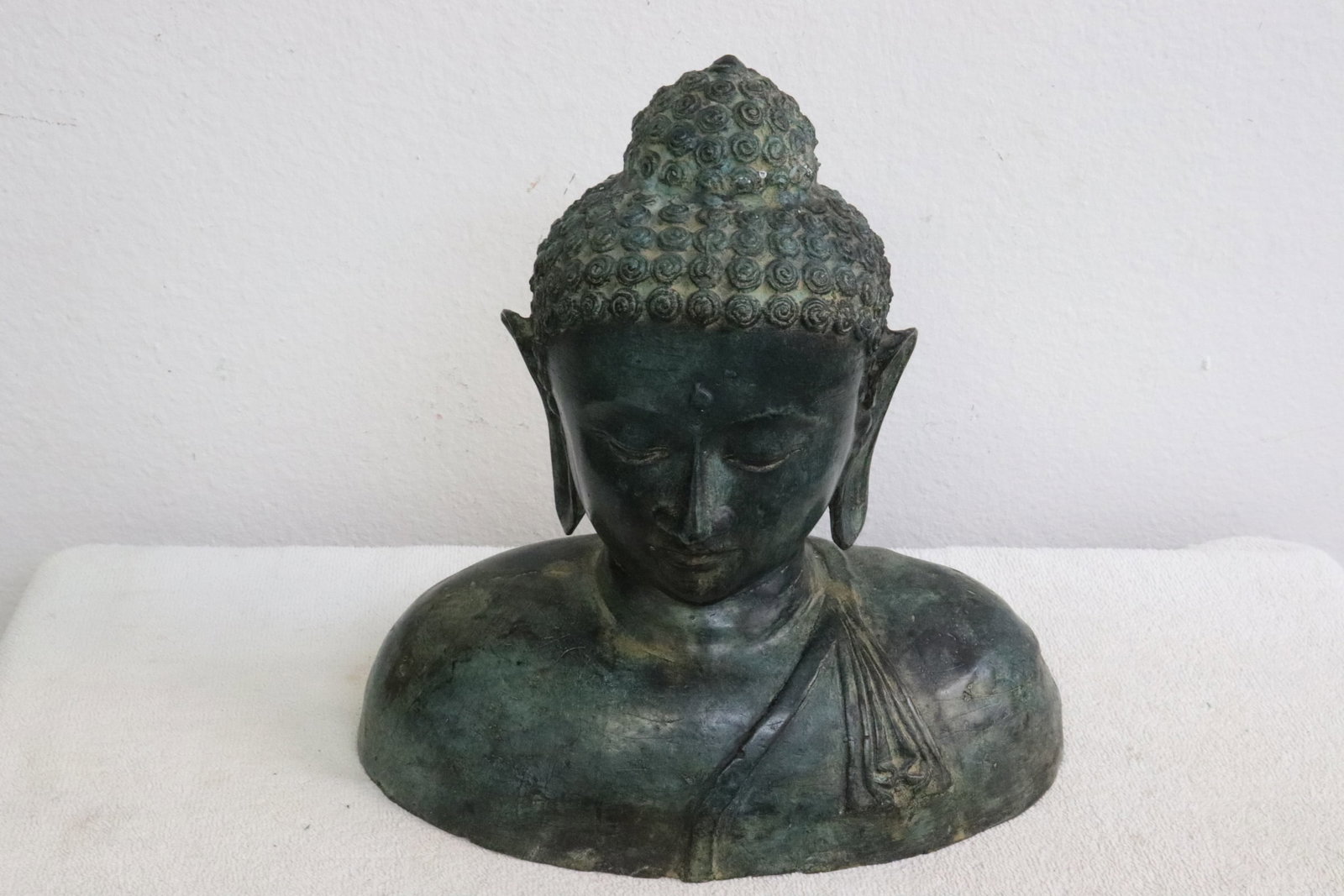 A large bronze sculpture of deity bust (1 of 7)