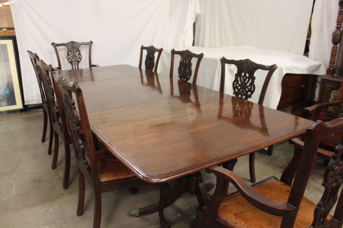 mahogany dining room set: A fine mahogany dining room set, the table can be extend to 12 feet (29"Hx48"x144"), with 8 finely carved Chippendale style chairs with leather seat (42"Hx20"Wx25"D each)