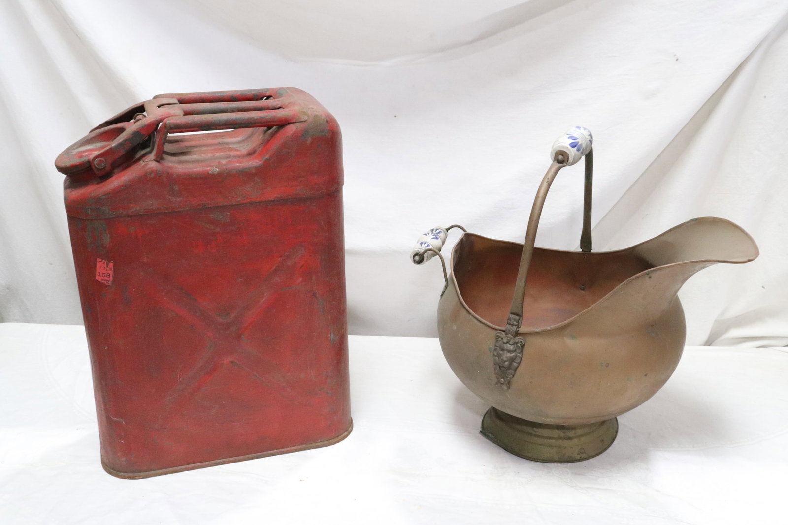 A metal gasoline can, and a copper coal basket: A metal gasoline can (18.6"x6.5"x13.6"), and a copper coal basket (16.8"x14"x18")