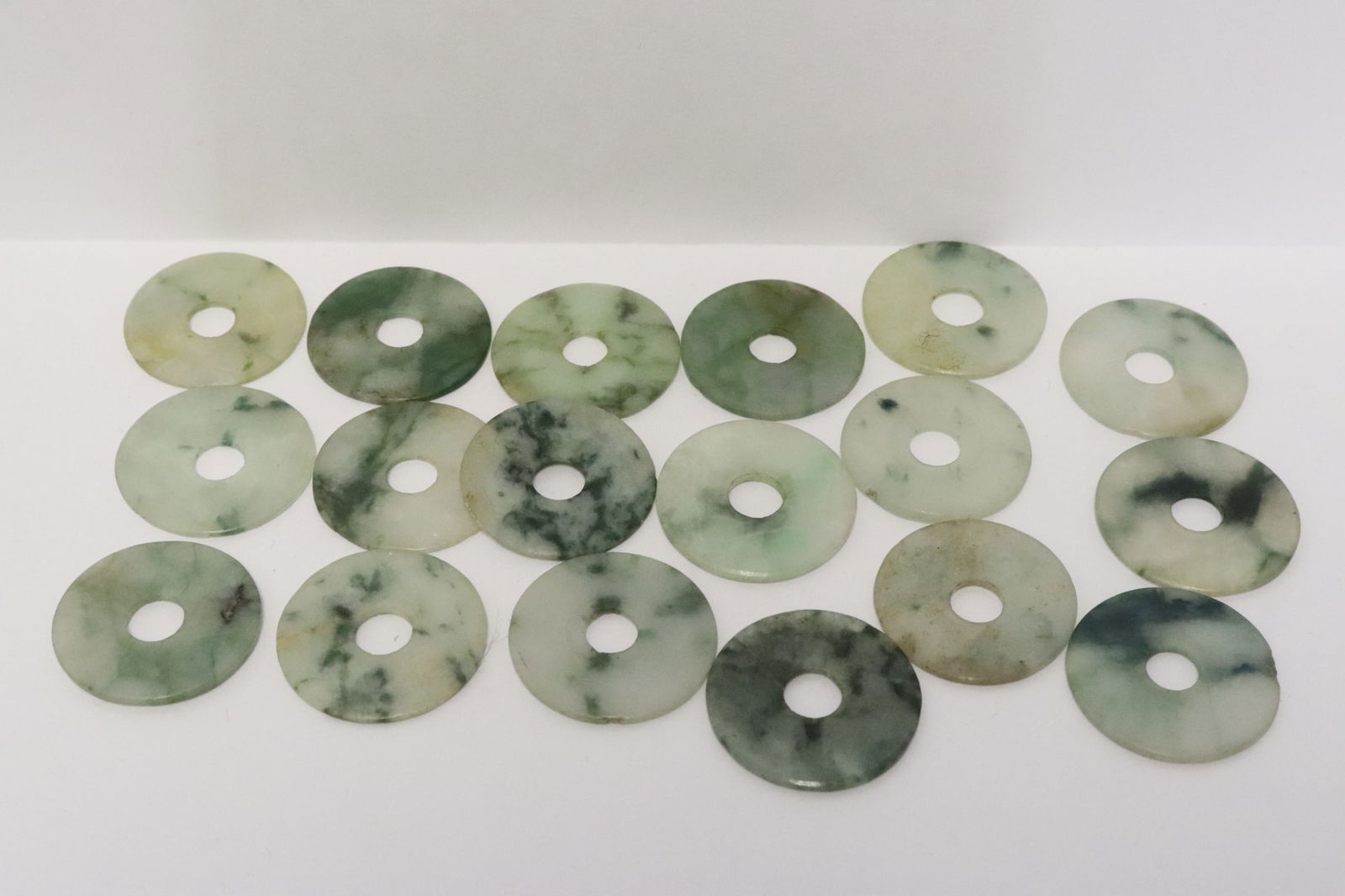 18 Chinese antique natural color jadeite disc: 18 Chinese antique natural color jadeite disc, each disc measure approx. 27mm diameter
