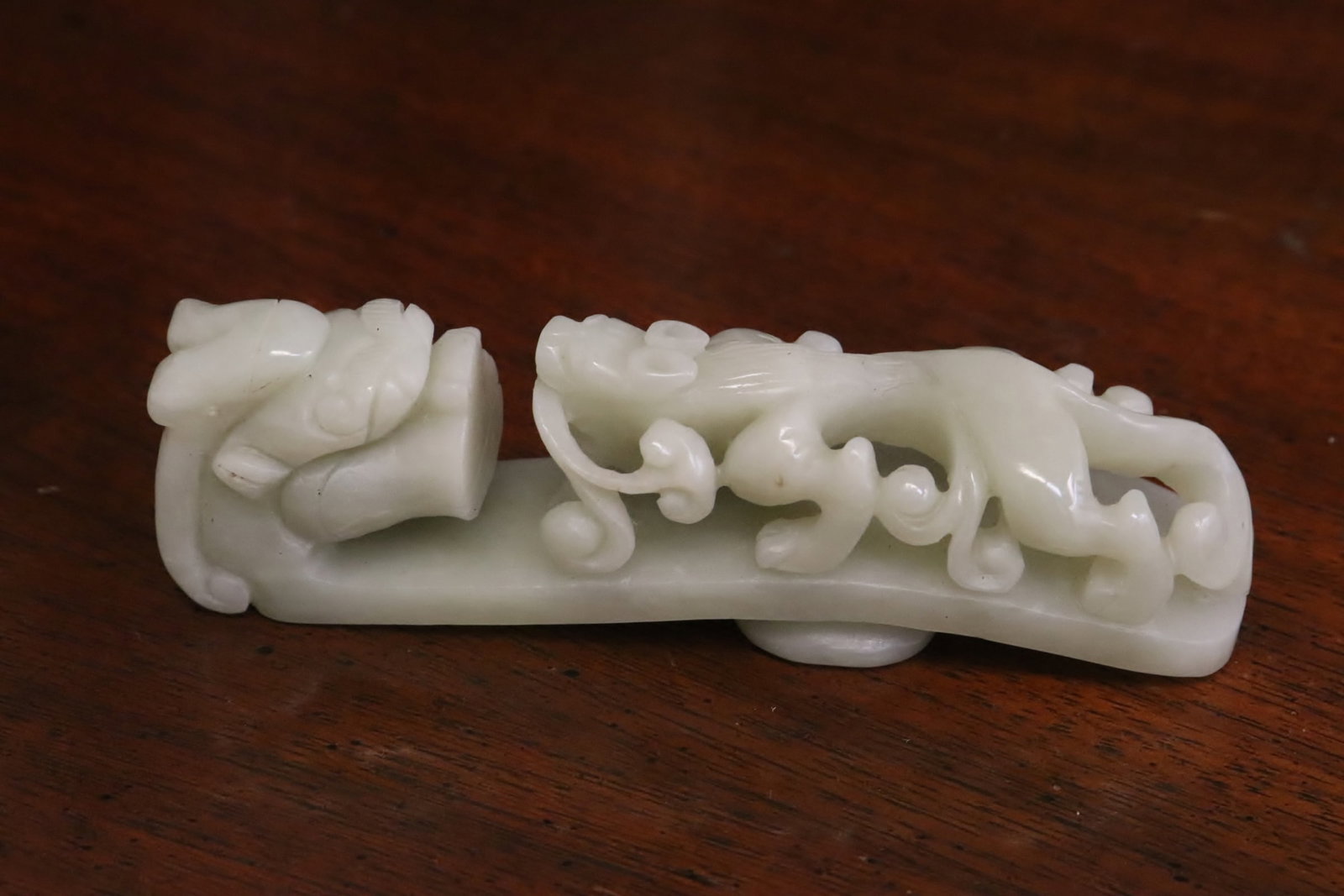 A jade belt buckle: A jade belt buckle, 3.65"L