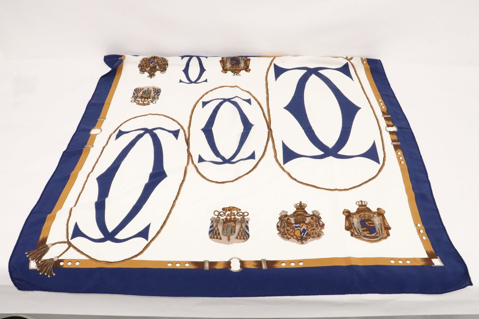 A marked Cartier scarf, not authenticated: A marked Cartier scarf, not authenticated, 33"x32"