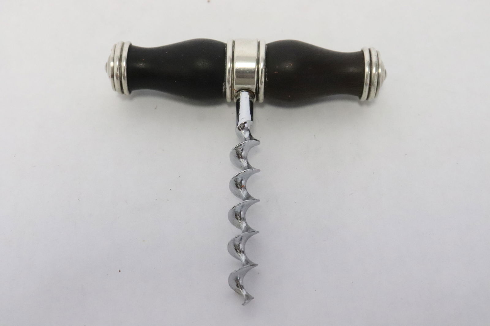 A wine bottle opener by Christofle, France: A wine bottle opener (3.45"x3.25"x0.75") by Christofle, France