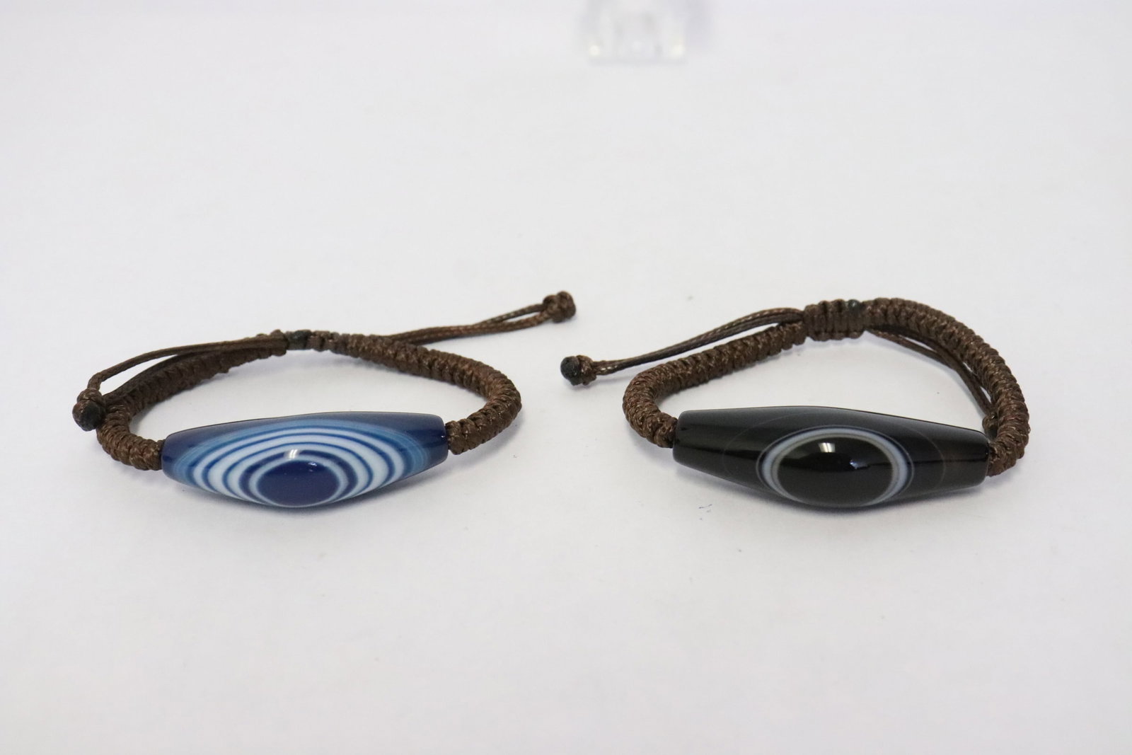 2 bracelets with bead: 2 bracelets with bead (1.75"x0.62"x0.55", 1.95"x0.65"x0.6")