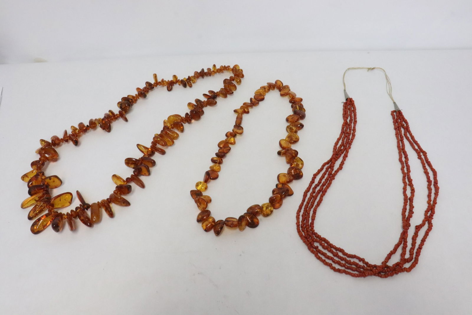 2 amber bead necklaces, & a coral like bead necklace (1 of 10)