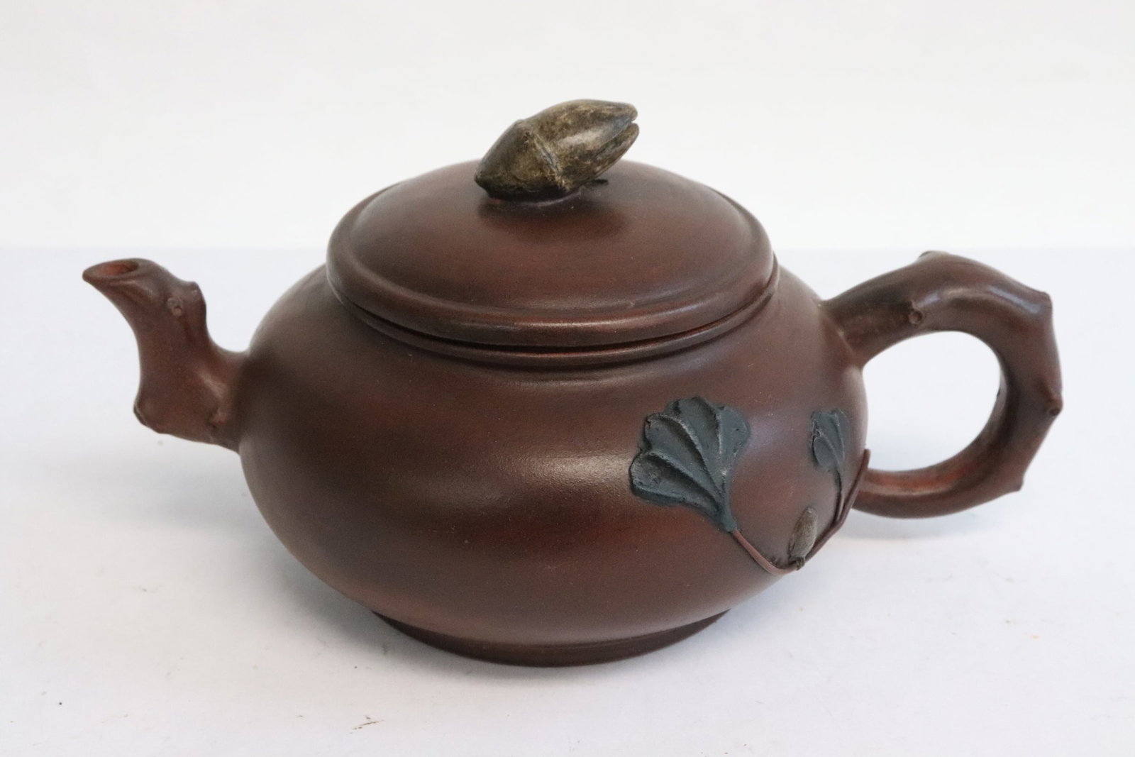 A Yixing teapot: A Yixing teapot, 3.65"x7.15"x4.7"