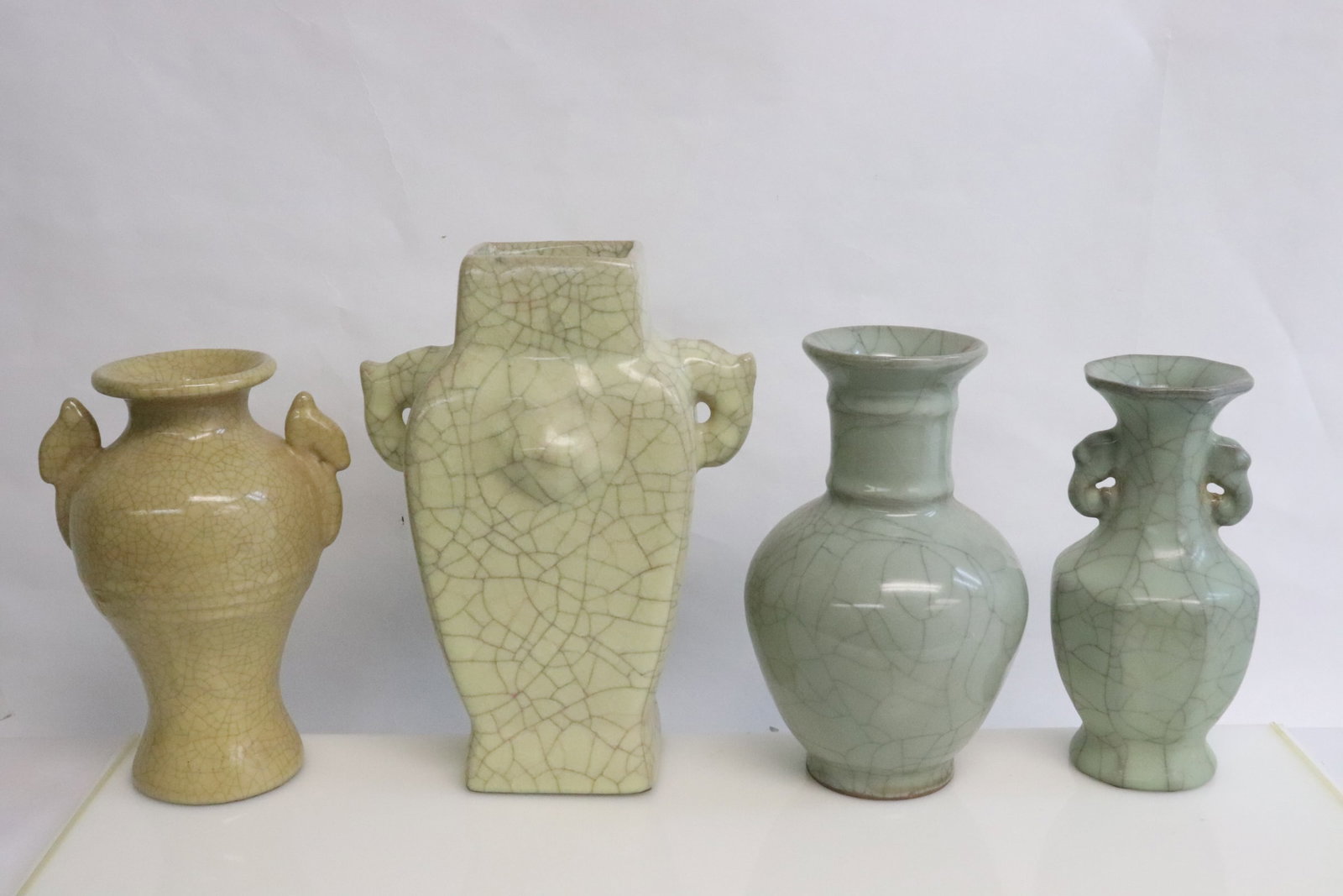 4 crackleware porcelain vases: 4 crackleware porcelain vases, 7.9"x3.8"x3.8" - 10.3"x7.4"x4.7"