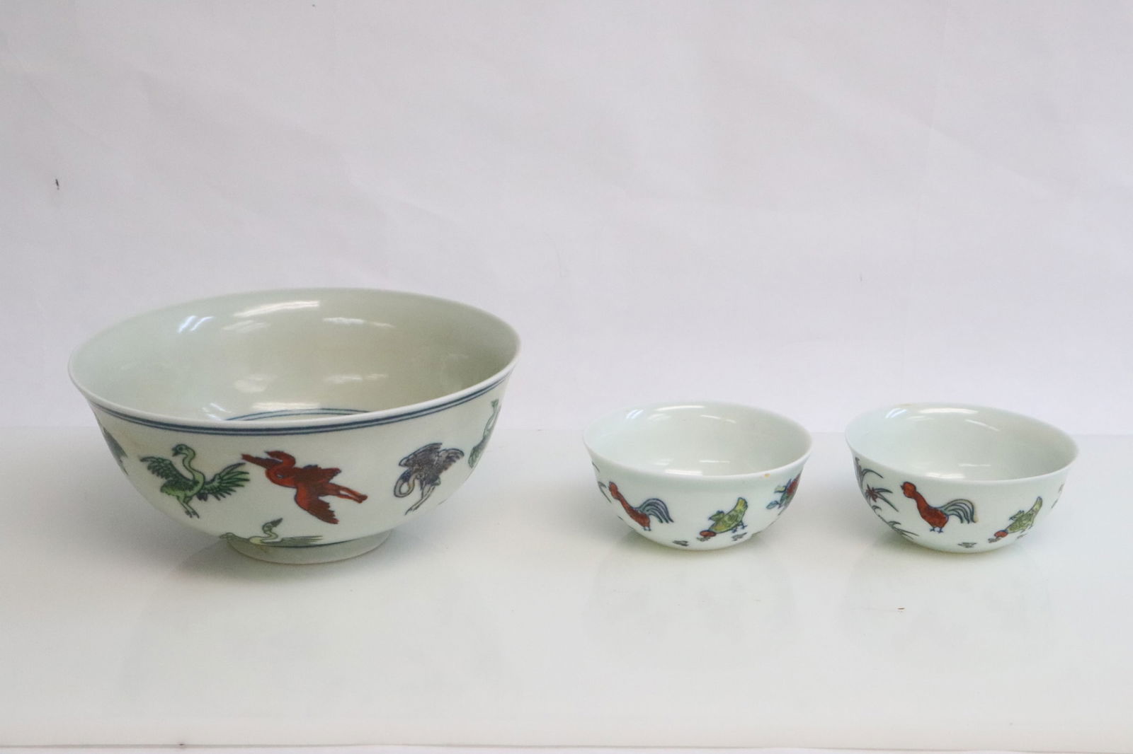 3 wucai porcelain pieces; 2 tea cups, and a bowl (1 of 8)