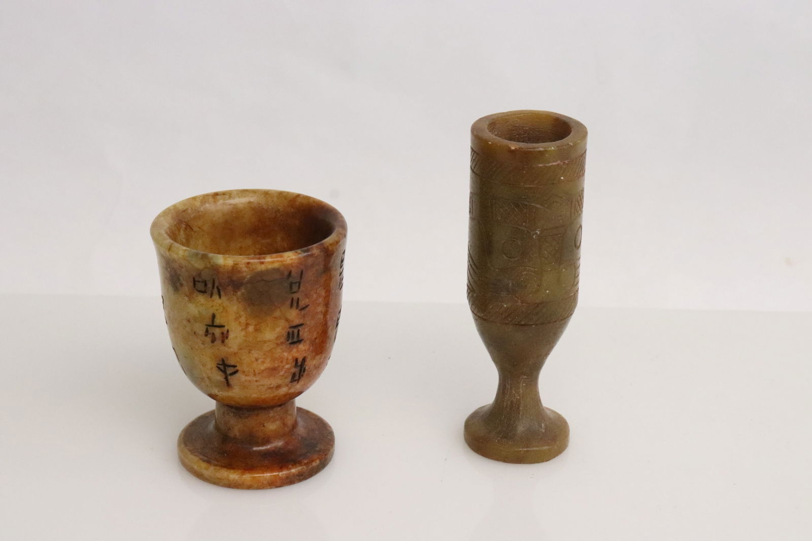 2 stone carved wine cups: 2 stone carved wine cups, 2.5"x1.85"dia, 3.4"x1.1"dia