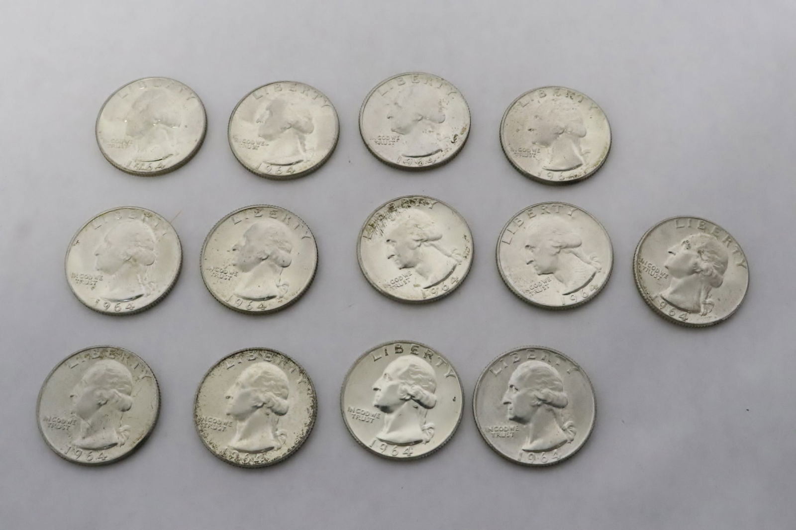 Thirteen 1964 silver quarter, from uncirculated roll (1 of 12)