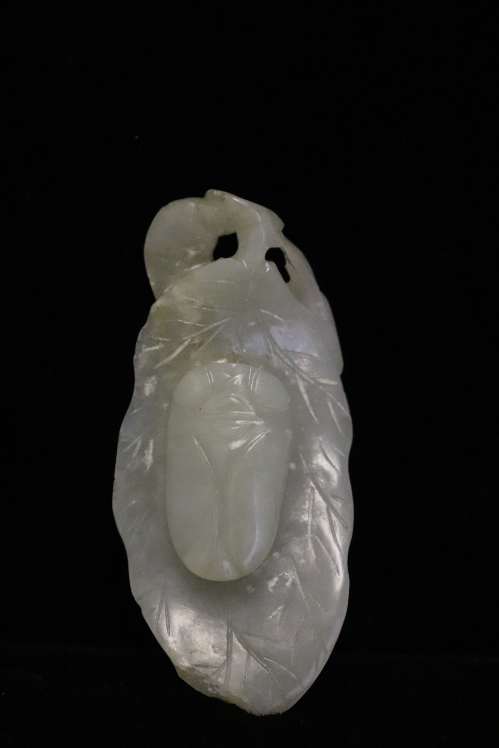 Chinese antique celadon jade carving: Chinese antique celadon jade carving depicting a bug on vegetable leaf, 2.35"L
