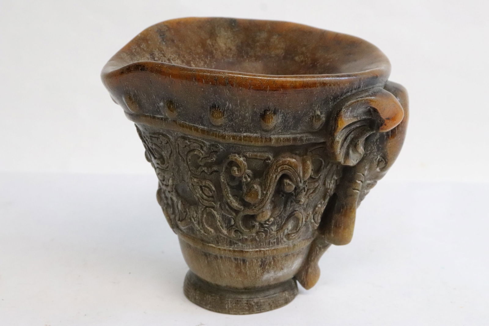 A simulated horn carved libation cup (1 of 8)