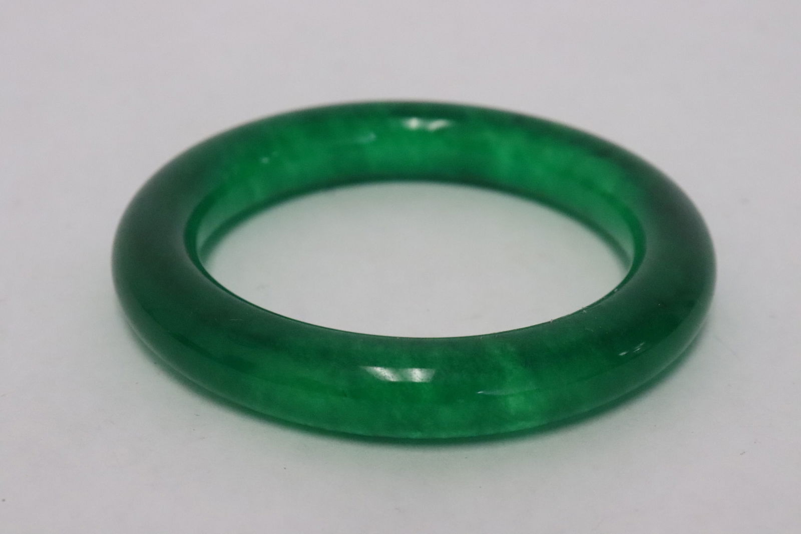 A jadeite like bangle: A jadeite like bangle, 0.5"x3.35"dia