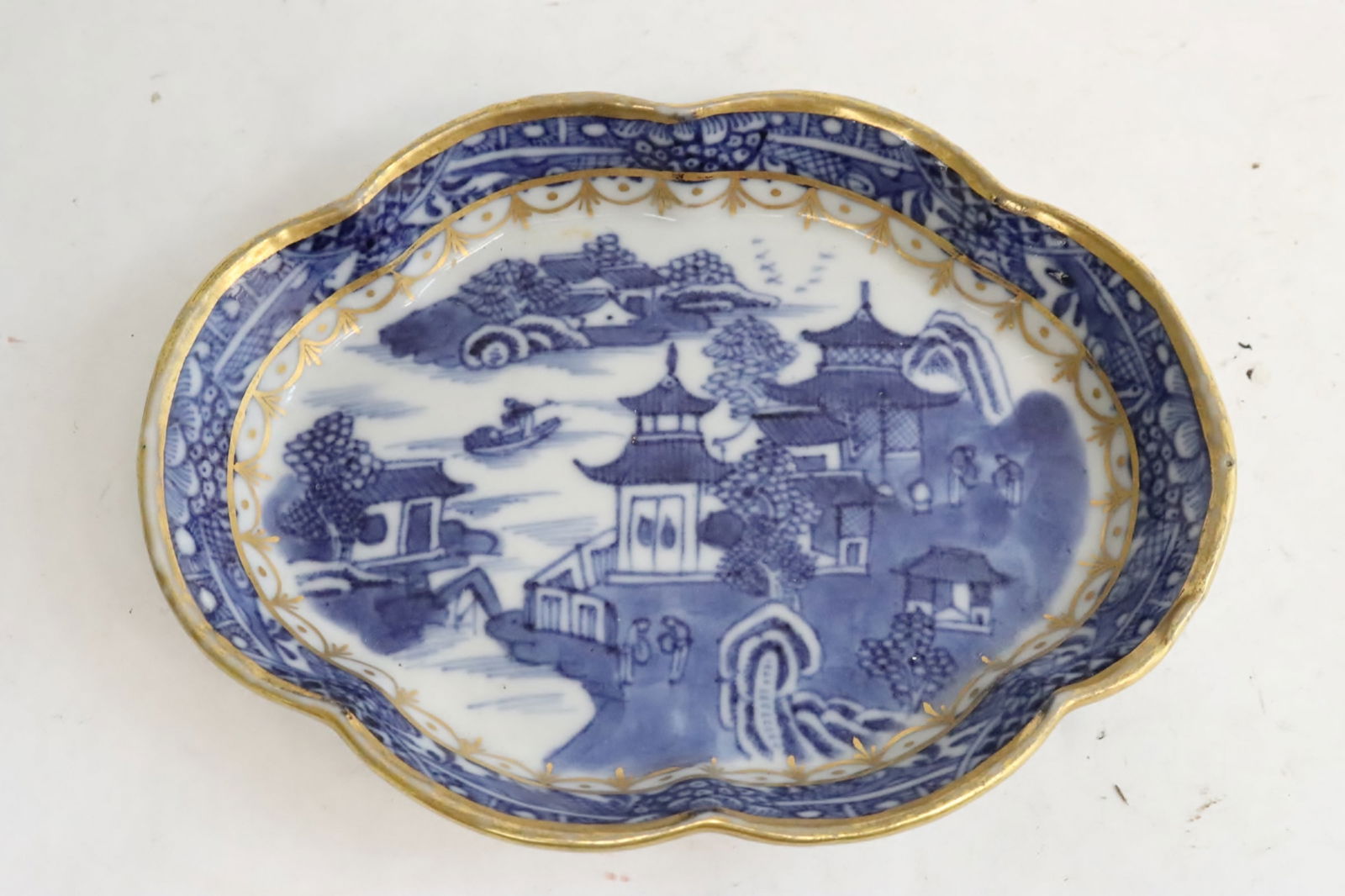 A small blue and white plate (1 of 6)