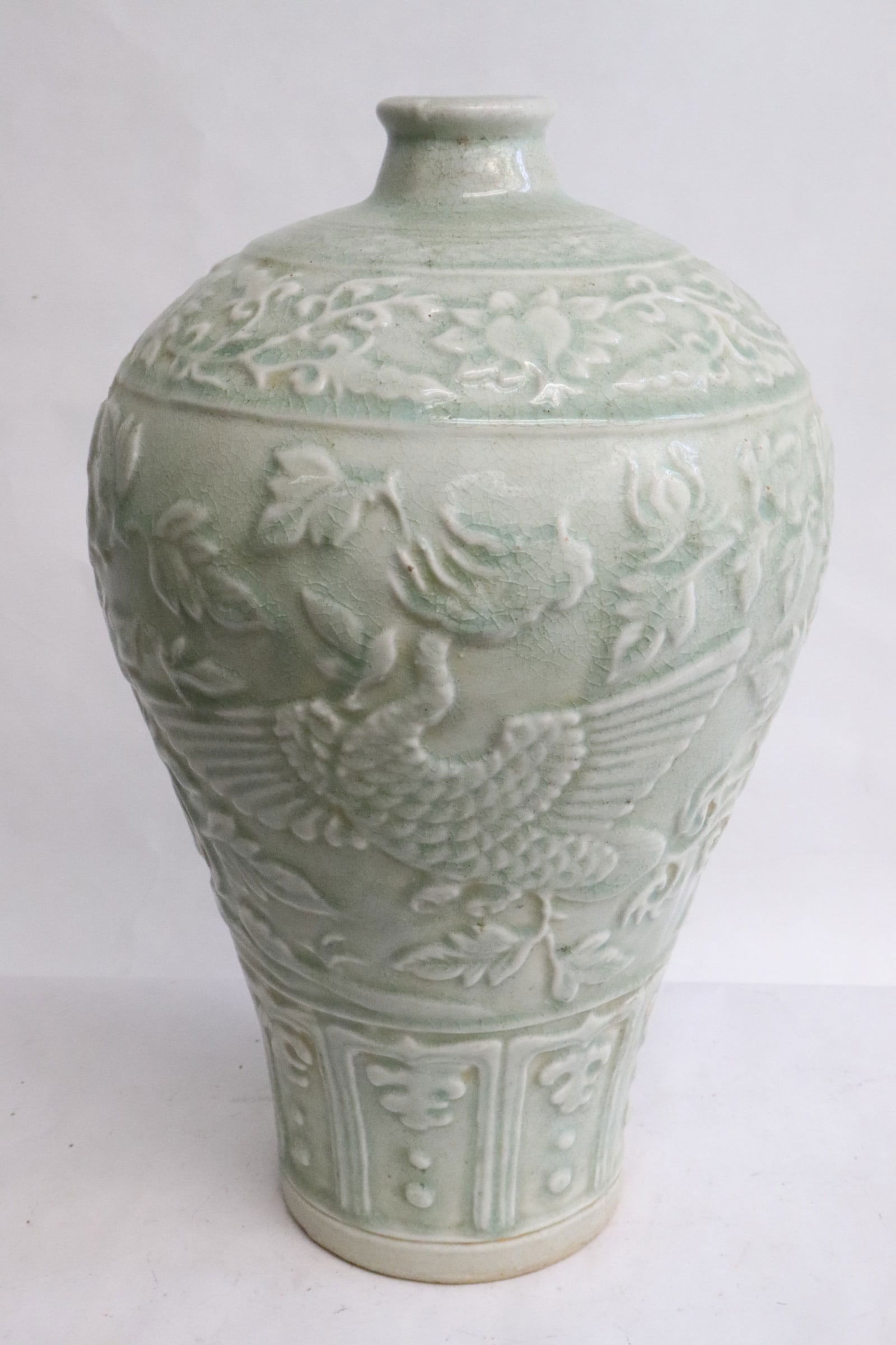 Celadon meiping: Celadon meiping embossed with floral motif decoration, 13.4"x8.4"dia