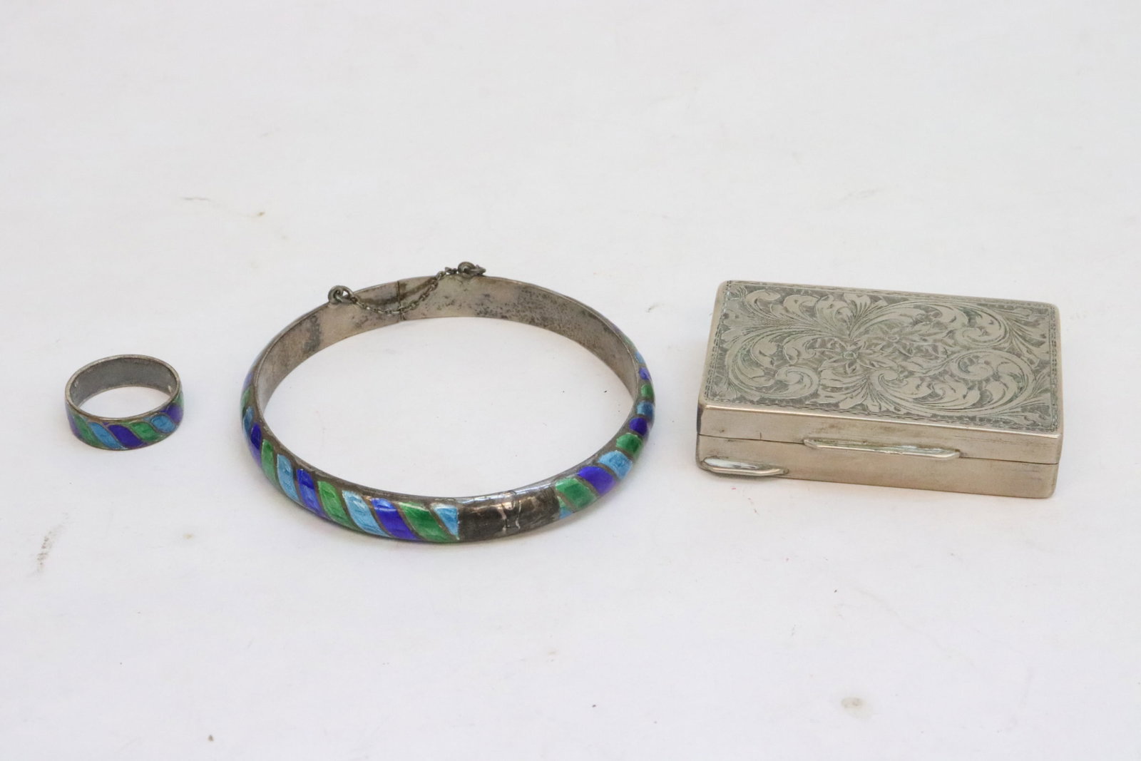 An 800 silver powder box, & 2 enamel on silver jewelry: An 800 silver powder box (2.3"x1.63"x0.5"), and 2 enamel on silver jewelry (a ring, and a bangle (0.33"x2.75"dia))
