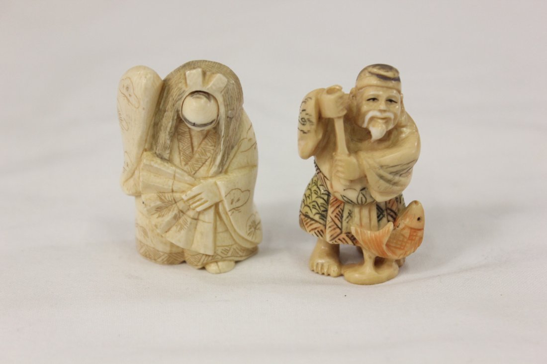 2 Japanese ivory carved netsuke: 2 Japanese ivory carved netsuke, one depicting old man with cane (2"x1.2"x0.9") (cane top missing), the other depicting man with rotation face (2"x1.5"x1")